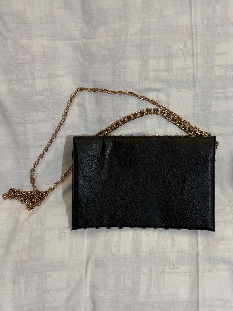 Black Studded Envelope Bag with Gold Chain (Category: Luxury Bags & Wallets) located in Malabon City. Submitted by hehehe_7 (Listing ID 1467263881, Image 2). Description: - Black envelope clutch with gold studs and a chain strap.