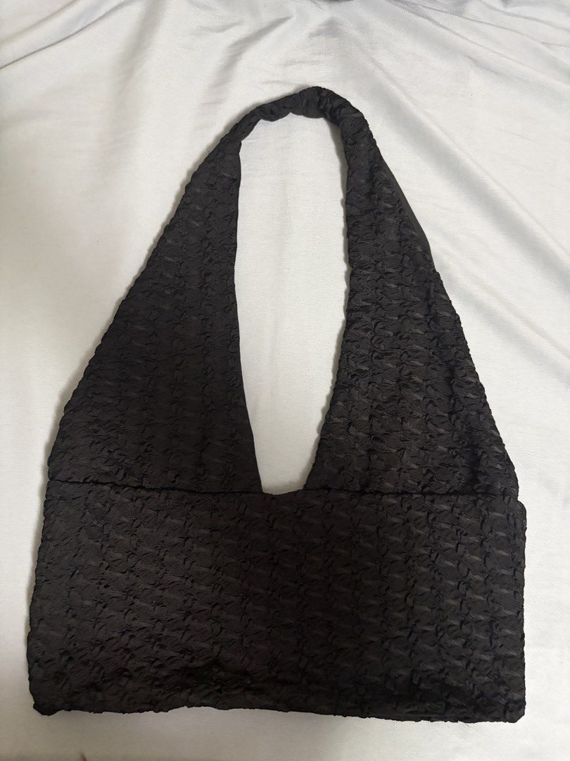 Black Textured Halter Crop Top Deep V-Neck (Category: Sleeveless) located in Quezon City. Submitted by j.steffy (Listing ID 1467330988, Image 1). Description: - Color: Black - Style: Halter crop top with deep V-neckline - Material: Stretchy fabric with a crinkled, bubbly texture - Fit: Fitted cropped style - Versatility: Easy to dress up for night outs or keep casual - Condition: Clean, no flaws found.