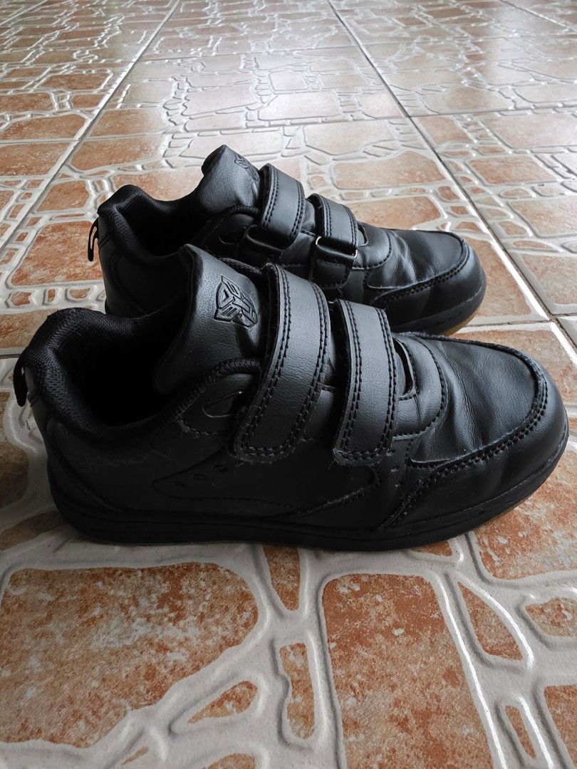 Black Transformers Velcro Sneakers Shoes (Category: Babies & Kids Fashion) located in Quezon City. Submitted by richcruz01.cc (Listing ID 1467256565, Image 2). Description: - Style: Casual black sneakers with easy double velcro strap closure - Design: Cool embossed Transformers logo on the tongue - Sole: Textured rubber outsoles offering great grip and traction - Condition: Minimal wear on soles, minor creasing on upper leather - Ideal For: Every