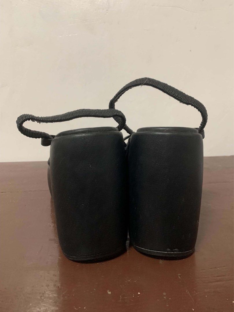 Black Wedge Sandals Size 10W (wide) (Category: Wedges) located in Borongan. Submitted by kabes_jane (Listing ID 1467188725, Image 2). Description: - Brand: Moleca - Color: Classic solid black - Heel Type: Wedge platform - Design: Multiple thin straps across the toe - Fit: Elastic slingback stretch backing for easy slip-on and secure wear - Details: Clean footbed with clear white logo text - Versatility: Pairs effortlessly with casual and dressy o