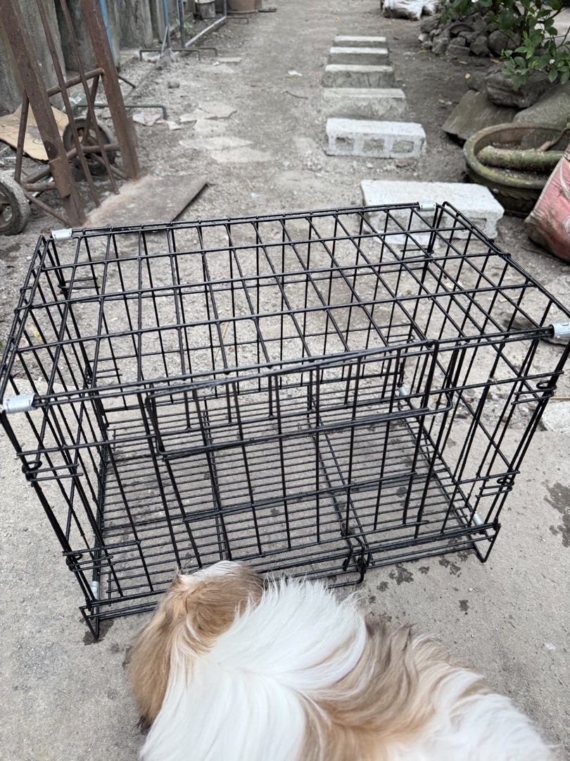Black Wire Pet Cage with Front Door (Category: Homes & Other Pet Accessories) located in Manila. Submitted by tracysophi08245 (Listing ID 1467257163, Image 1). Description: - Sturdy black wire metal construction - Drop-down front door with a secure latch closure for easy access - Includes top and side wire panels for great ventilation - Ideal size for small dogs or cats - Clean condition and ready to use.