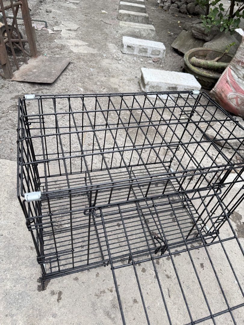 Black Wire Pet Cage with Front Door (Category: Homes & Other Pet Accessories) located in Manila. Submitted by tracysophi08245 (Listing ID 1467257163, Image 2). Description: - Sturdy black wire metal construction - Drop-down front door with a secure latch closure for easy access - Includes top and side wire panels for great ventilation - Ideal size for small dogs or cats - Clean condition and ready to use.