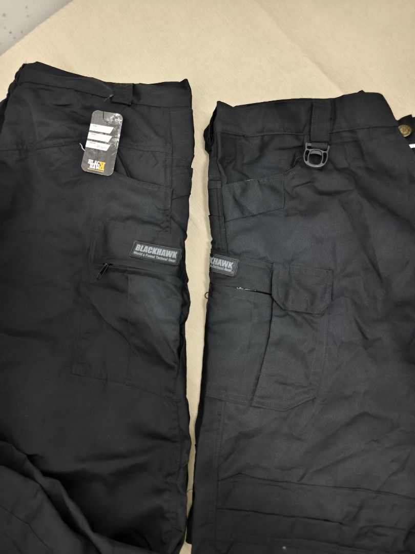 Blackhawk Tactical Cargo Pants Black (Category: Trousers) located in Angeles City. Submitted by measaliman02351 (Listing ID 1467276527, Image 2). Description: - Brand: Blackhawk - Color: Solid Black - Condition: Brand new with original tag attached - Fit: Standard fit with straight legs - Material: Durable fabric with reinforced stitching - Pockets: Multiple utility pockets with secure zippers and flaps - Features: Built-in D-ring attachment on t