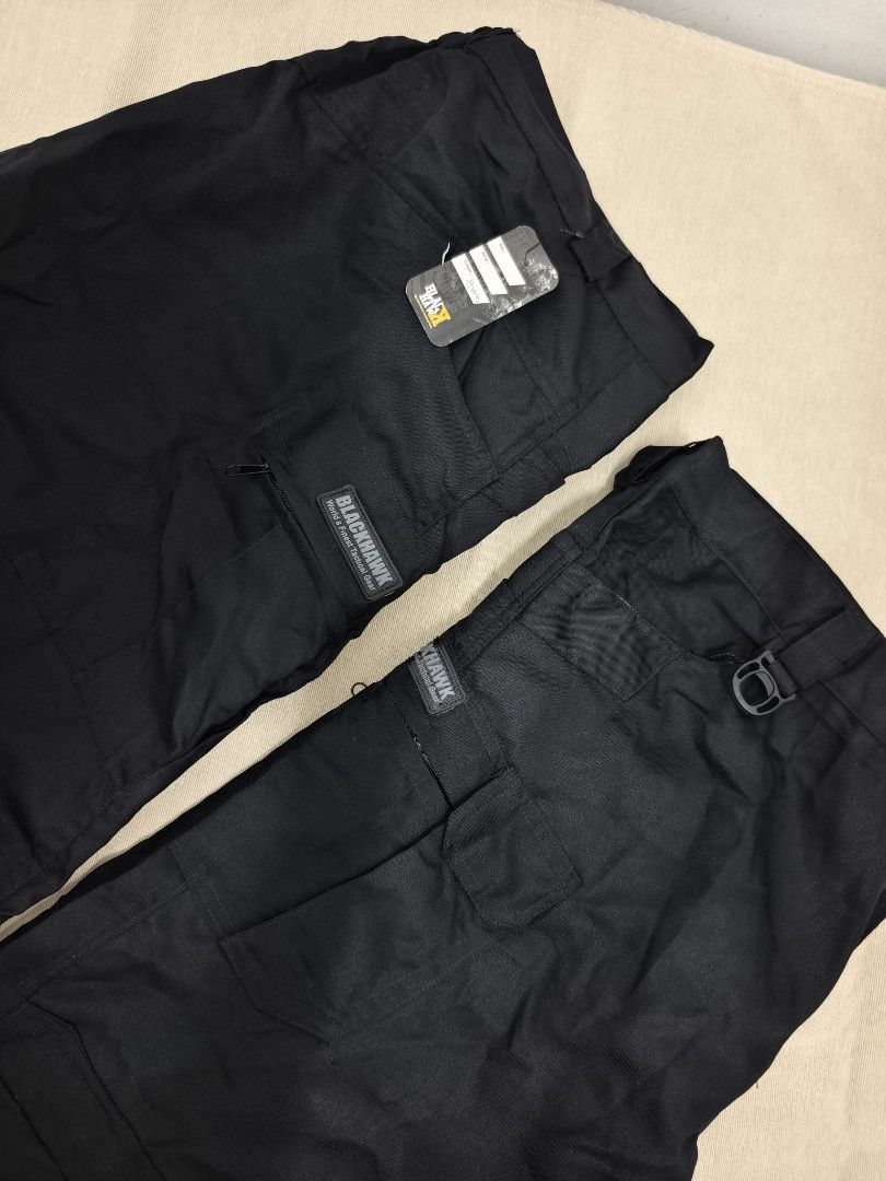 Blackhawk Tactical Cargo Pants Black (Category: Trousers) located in Angeles City. Submitted by measaliman02351 (Listing ID 1467276527, Image 3). Description: - Brand: Blackhawk - Color: Solid Black - Condition: Brand new with original tag attached - Fit: Standard fit with straight legs - Material: Durable fabric with reinforced stitching - Pockets: Multiple utility pockets with secure zippers and flaps - Features: Built-in D-ring attachment on t