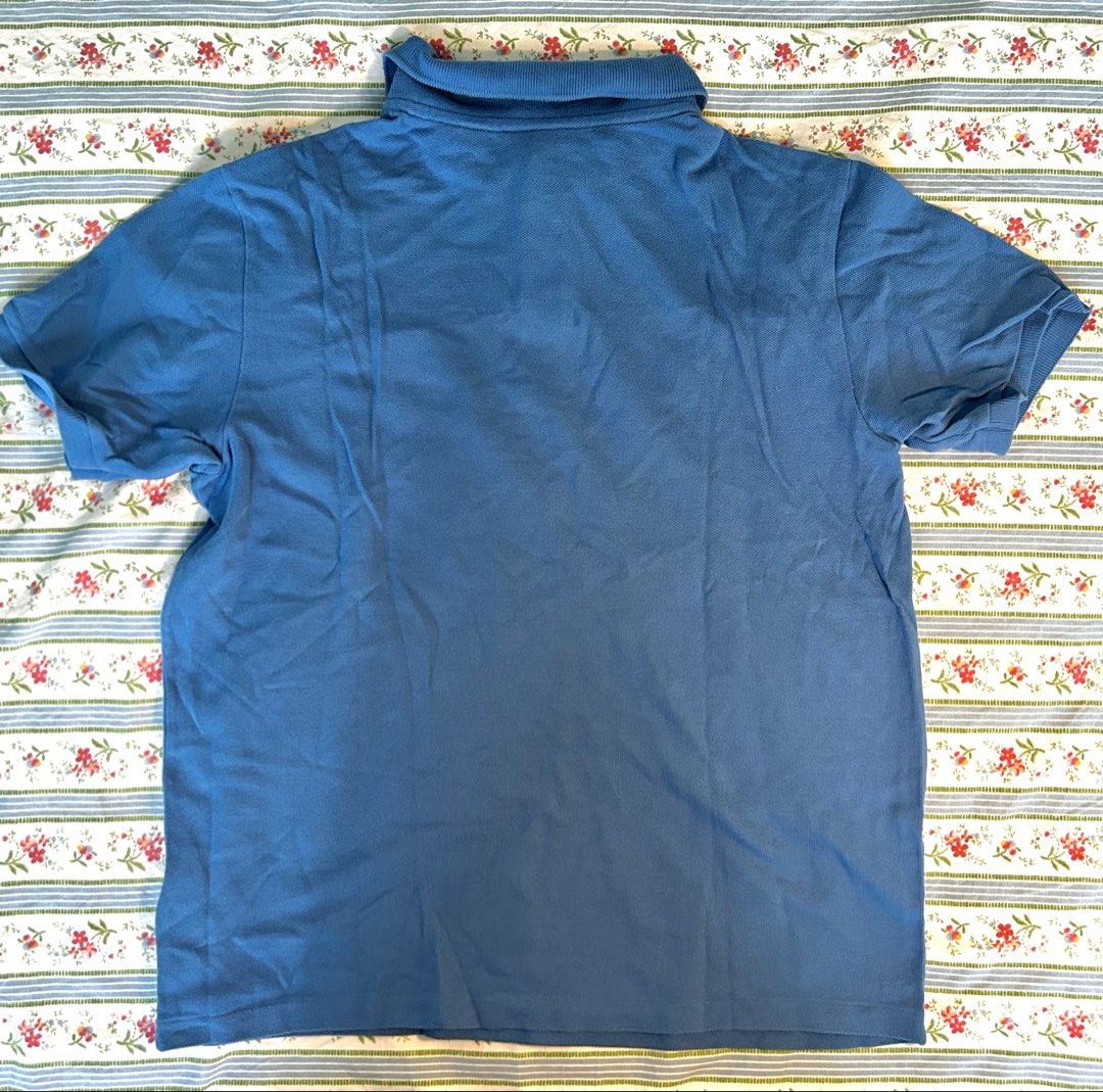 Blue Lacoste Polo (Category: Tshirts & Polo Shirts ) located in Quezon City. Submitted by bunnny23 (Listing ID 1467265959, Image 2). Description: 56.5 cm x 45.5 cm Bought in the States Used, got too small on me.