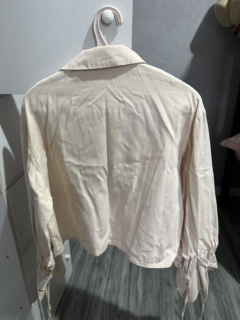 BOCU Cream Button-Up Blouse with Statement Cuffs (Category: Blouses) located in Valenzuela. Submitted by crzrvll26 (Listing ID 1467204199, Image 2). Description: - Brand: BOCU - Color: Cream (easy to match with any outfit) - Style: Long-sleeve button-down with pointed lapel collar - Details: Single-button front closure and statement voluminous sleeves with wide flared cuffs - Fabric: Lightweight and comfortable - Perfect for: Casual daily wear or