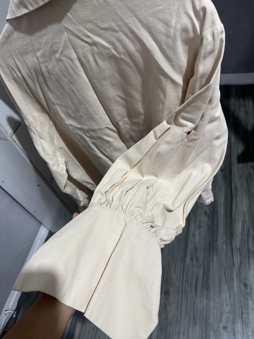 BOCU Cream Button-Up Blouse with Statement Cuffs (Category: Blouses) located in Valenzuela. Submitted by crzrvll26 (Listing ID 1467204199, Image 3). Description: - Brand: BOCU - Color: Cream (easy to match with any outfit) - Style: Long-sleeve button-down with pointed lapel collar - Details: Single-button front closure and statement voluminous sleeves with wide flared cuffs - Fabric: Lightweight and comfortable - Perfect for: Casual daily wear or