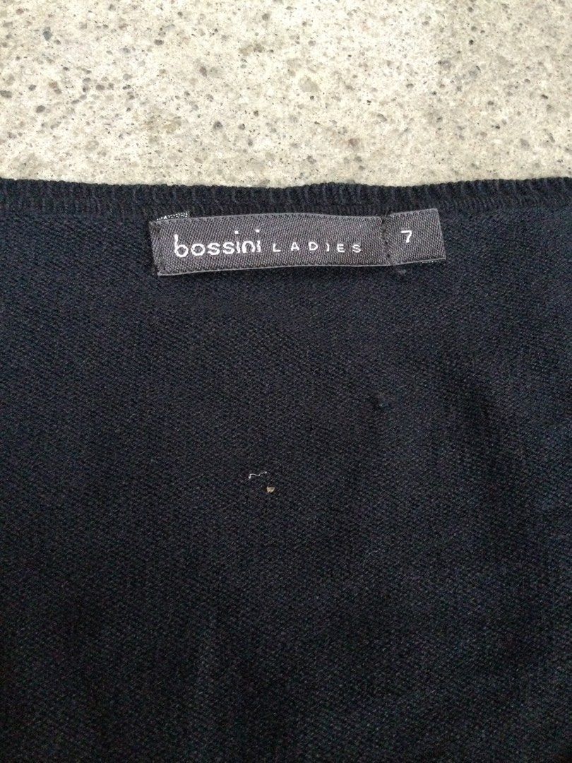 Bossini Black Knitted Cropped Cardigan (Category: Longsleeves) located in Binangonan. Submitted by ininnep (Listing ID 1467322423, Image 2). Description: ✅ Brand Bossini Ladies — a well-known casual wear brand from Hong Kong 🧥 Item Black cropped 3/4-sleeve cardigan 📝 Details • Neckline: Wide scoop/round neck • Closure: Vertical row of small, round, silver-toned buttons • Sleeves: 3/4 length • Fit & length: Cropped, fitted style • Size: 7 (Bossi