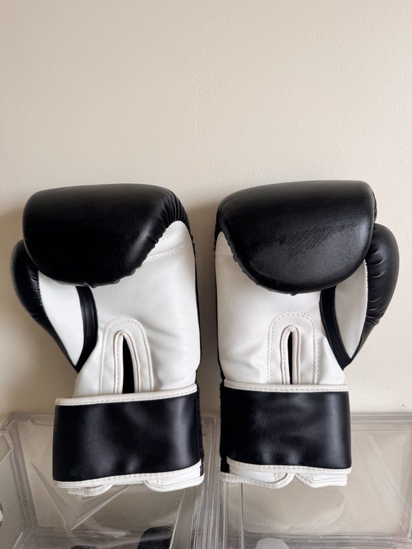 Boxing Gloves (Category: Other Sports Equipment and Supplies) located in Pasig City. Submitted by reneltibo33257 (Listing ID 1467184597, Image 1). Description: Titans boxing gloves Size 9 Used twice only for muay thai practice .