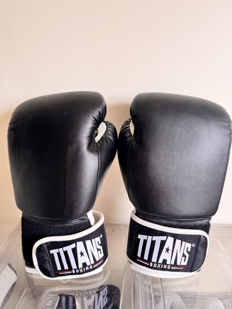 Boxing Gloves (Category: Other Sports Equipment and Supplies) located in Pasig City. Submitted by reneltibo33257 (Listing ID 1467184597, Image 2). Description: Titans boxing gloves Size 9 Used twice only for muay thai practice .