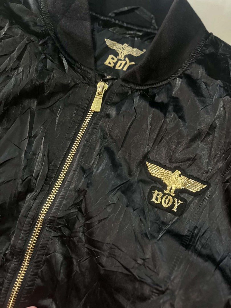 BOY LONDON BOMBER JACKET - BLACK GOLD EDITION (Category: Coats, Jackets and Outerwear) located in Manila. Submitted by silentforest_c1f6e4 (Listing ID 1467342719, Image 3). Description: - Size: Fit S to M Adult / Unisex - Condition: 9/10 - Shrpy pa! Embroidery malinis, zipper goods - Details: Bomber Jacket, Gold Eagle Logo, Embroidered Sleeve, Satin Type - Style: Pang streetwear, pang OOTD, pang concert!.