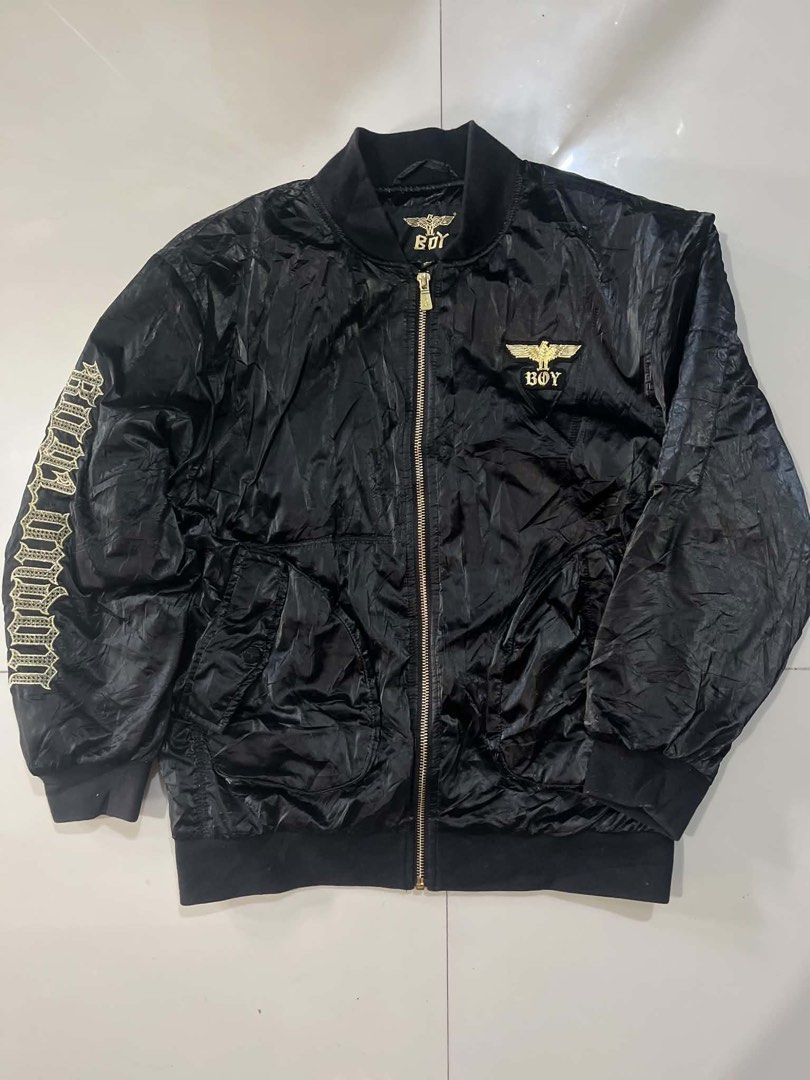BOY LONDON BOMBER JACKET - BLACK GOLD EDITION (Category: Coats, Jackets and Outerwear) located in Manila. Submitted by silentforest_c1f6e4 (Listing ID 1467342719, Image 1). Description: - Size: Fit S to M Adult / Unisex - Condition: 9/10 - Shrpy pa! Embroidery malinis, zipper goods - Details: Bomber Jacket, Gold Eagle Logo, Embroidered Sleeve, Satin Type - Style: Pang streetwear, pang OOTD, pang concert!.