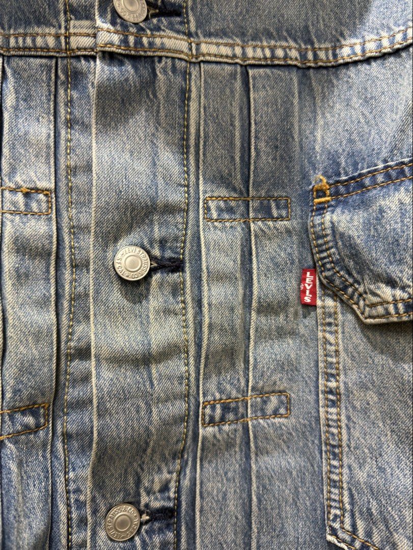 Brandnew Levi's Denim Jacket (Category: Coats, Jackets and Outerwear) located in Bacoor. Submitted by preloved_with_love_ (Listing ID 1467190790, Image 3). Description: Brandnew removed tag only - Brand: Levi Strauss & Co. - Style: Classic denim jacket in light blue wash - Size: L - Details: Button-up front, branded silver hardware, dual chest pockets, and standard collar - Origin: Made in China - Condition: Excellent, standard care label intact.