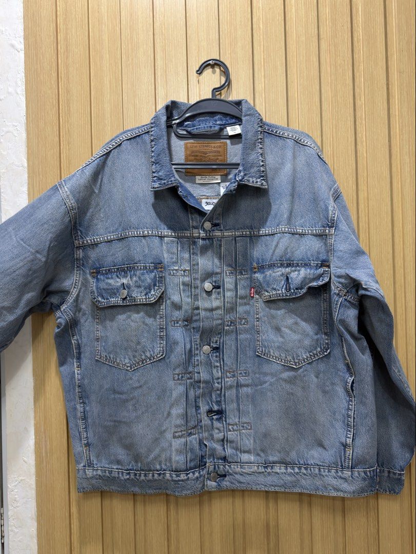 Brandnew Levi's Denim Jacket (Category: Coats, Jackets and Outerwear) located in Bacoor. Submitted by preloved_with_love_ (Listing ID 1467190790, Image 2). Description: Brandnew removed tag only - Brand: Levi Strauss & Co. - Style: Classic denim jacket in light blue wash - Size: L - Details: Button-up front, branded silver hardware, dual chest pockets, and standard collar - Origin: Made in China - Condition: Excellent, standard care label intact.