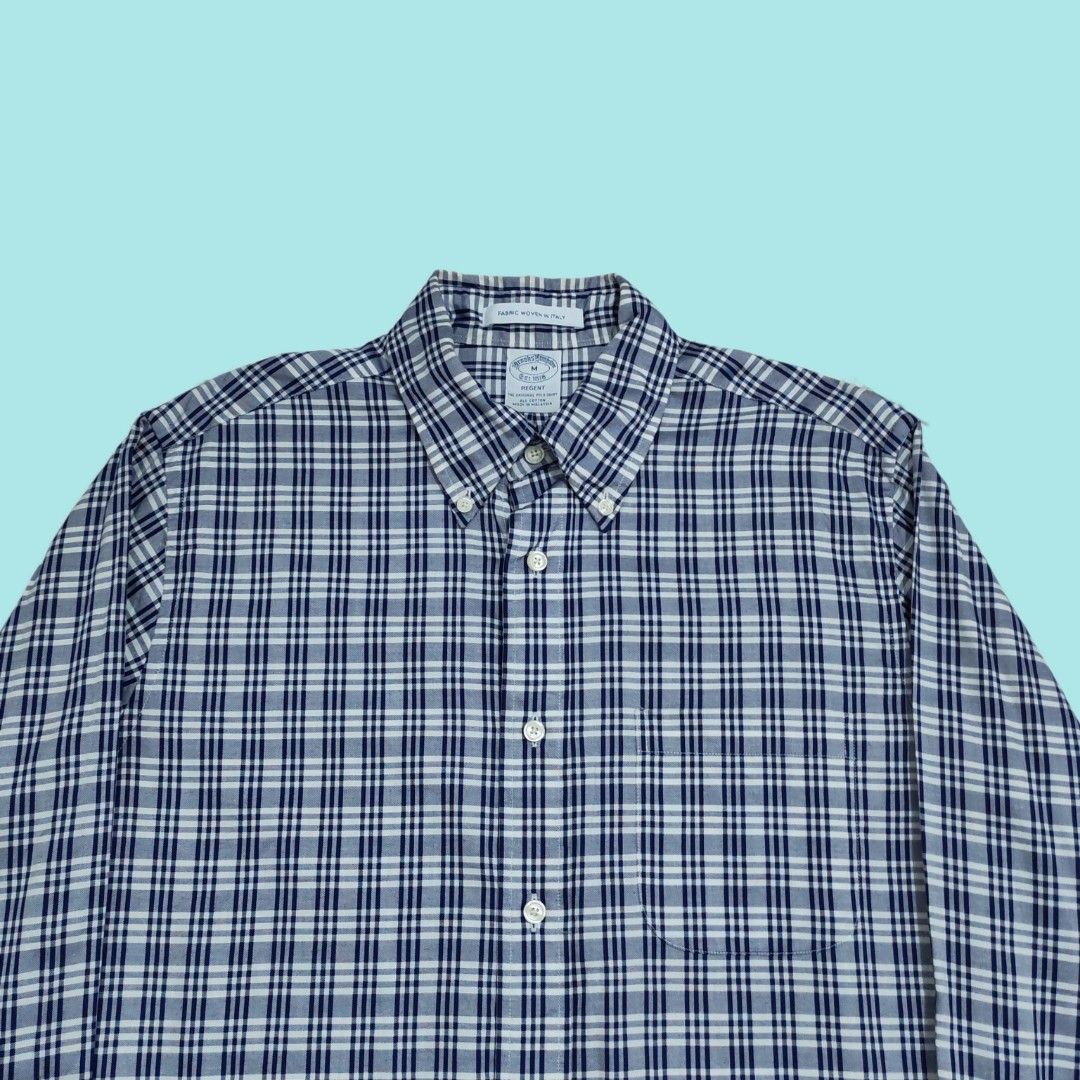 Brooks Brothers Regent Plaid Button-Down Shirt (Category: Formal Shirts) located in Tarlac. Submitted by senkustuff (Listing ID 1467314136, Image 2). Description: - Brand: Brooks Brothers - Size: Medium (Regent Fit) - Pattern: Classic blue and white plaid - Material: 100% Cotton with fabric woven in Italy - Features: Button-down collar, single chest pocket, and adjustable button cuffs - Condition: Excellent, clean, and sharp look for smart-casual