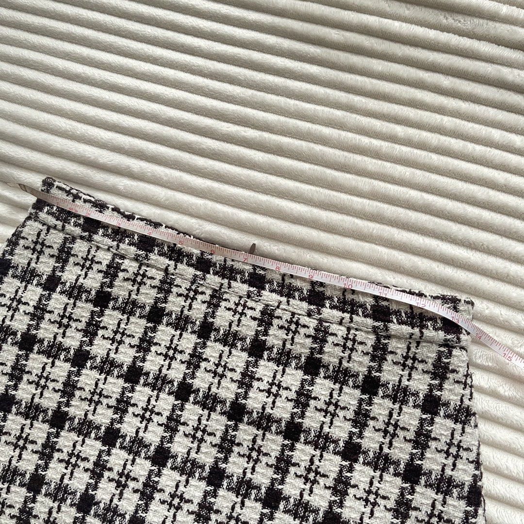 Brown and Cream Tweed Skort Checked Pattern (Category: Skirts) located in Muntinlupa City. Submitted by sza1123 (Listing ID 1467231540, Image 2). Description: - Fit: High waist with a structured silhouette - Material: Textured tweed fabric with clean hemlines - Versatility: Great for casual outings or work - Sizing: Laid flat measurements shown in photos.