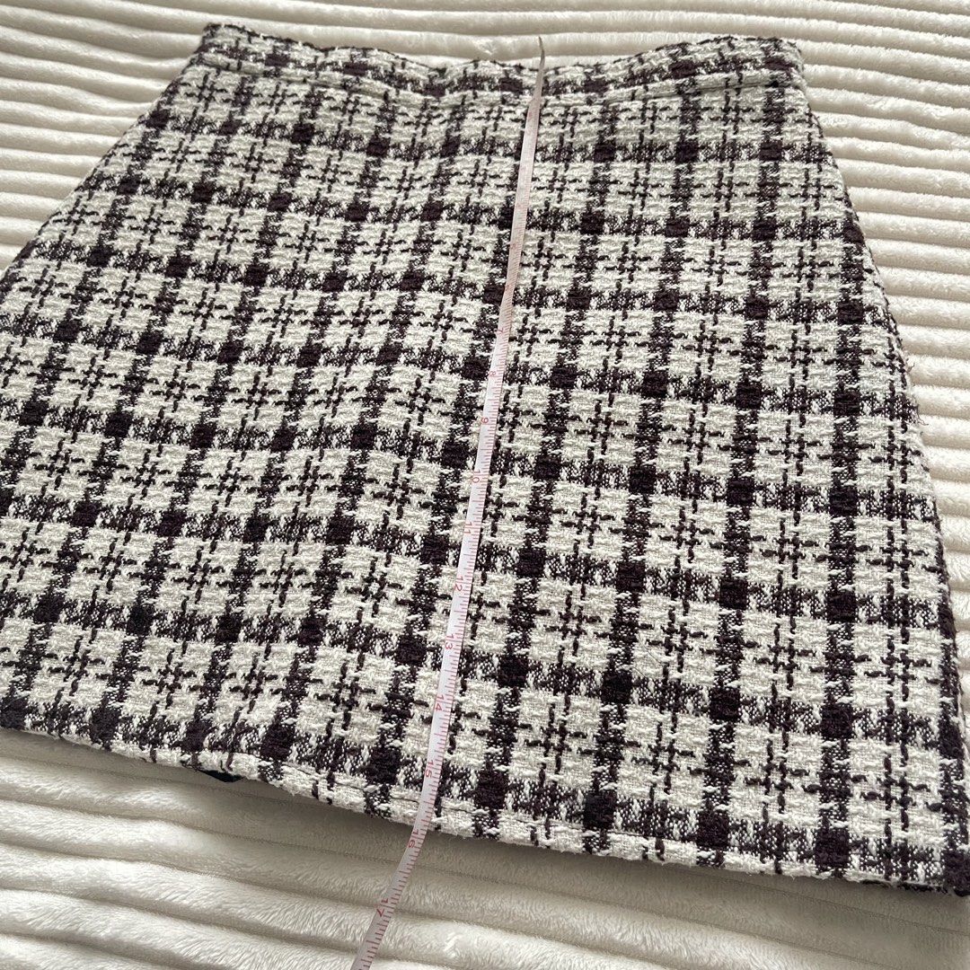 Brown and Cream Tweed Skort Checked Pattern (Category: Skirts) located in Muntinlupa City. Submitted by sza1123 (Listing ID 1467231540, Image 3). Description: - Fit: High waist with a structured silhouette - Material: Textured tweed fabric with clean hemlines - Versatility: Great for casual outings or work - Sizing: Laid flat measurements shown in photos.