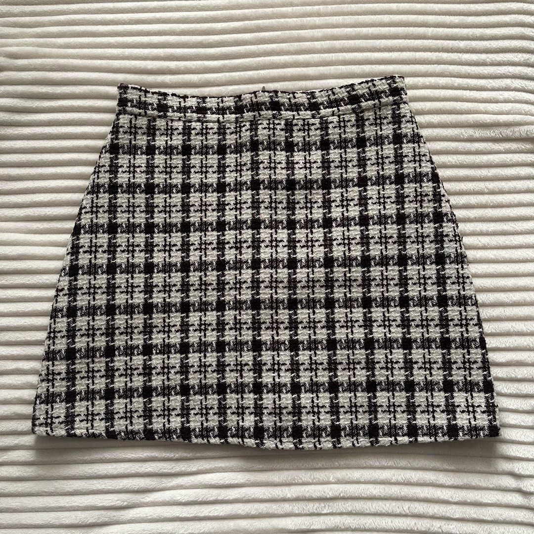 Brown and Cream Tweed Skort Checked Pattern (Category: Skirts) located in Muntinlupa City. Submitted by sza1123 (Listing ID 1467231540, Image 1). Description: - Fit: High waist with a structured silhouette - Material: Textured tweed fabric with clean hemlines - Versatility: Great for casual outings or work - Sizing: Laid flat measurements shown in photos.