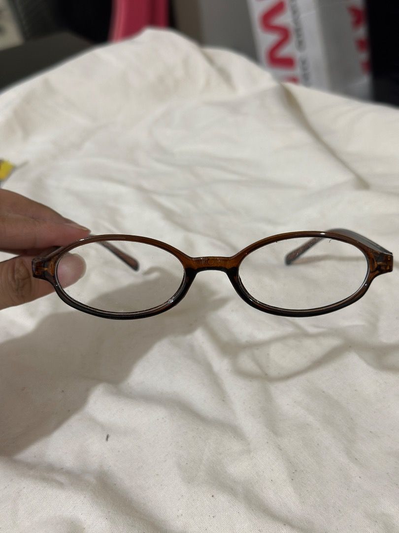 Brown Oval Frame Glasses Reading Glasses (Category: Sunglasses & Eyewear) located in Mandaluyong City. Submitted by lovedbyjaaaam (Listing ID 1467279889, Image 2). Description: - Style: Brown oval frames with a stylish tortoise-style pattern - Lenses: Clear, clean condition with no major scratches - Comfort: Lightweight build with comfortable temples for all-day wear - Fit: Standard fit, perfect for daily use or blue light blocking.