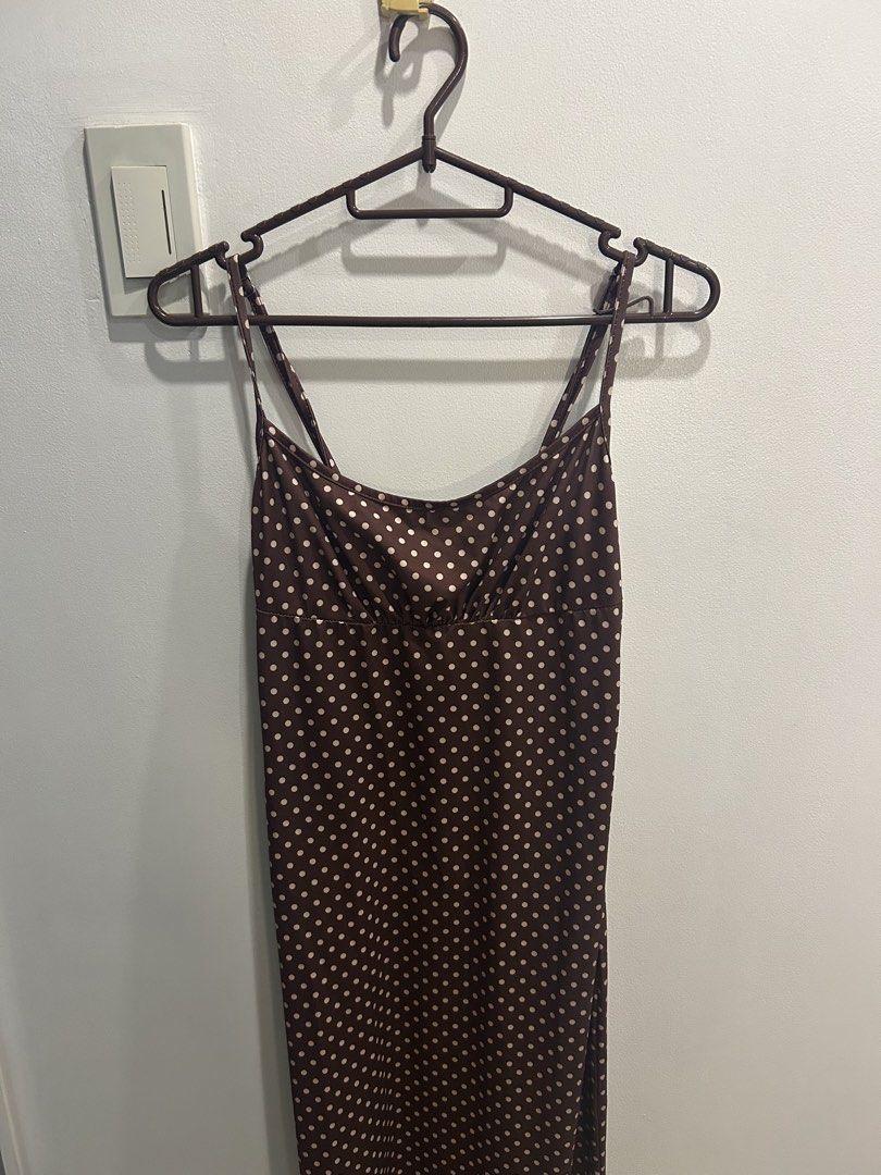 Brown Polka Dot Maxi Slip Dress (Category: Dresses) located in Manila. Submitted by lorasworld (Listing ID 1467258065, Image 2). Description: - Color & Pattern: Brown with white polka dots - Style: Midi slip dress with scoop neckline and ruched chest - Straps: Adjustable spaghetti straps with a chic double-strap back design.