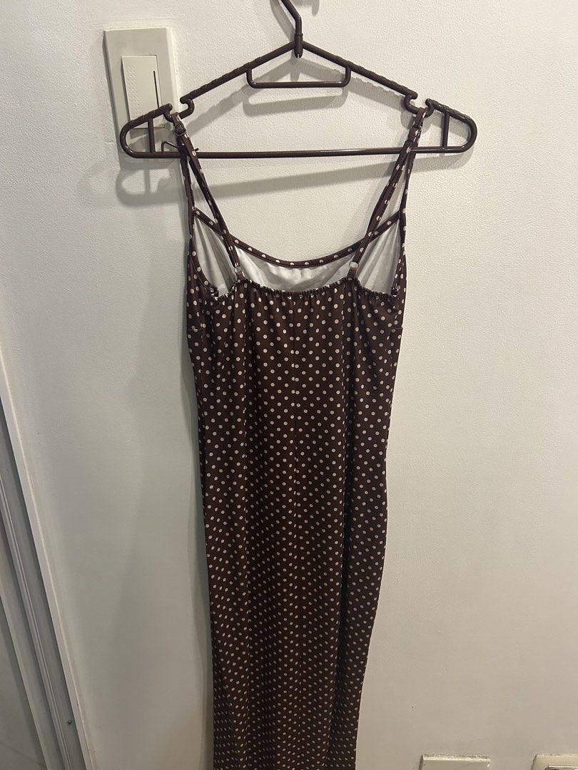 Brown Polka Dot Maxi Slip Dress (Category: Dresses) located in Manila. Submitted by lorasworld (Listing ID 1467258065, Image 3). Description: - Color & Pattern: Brown with white polka dots - Style: Midi slip dress with scoop neckline and ruched chest - Straps: Adjustable spaghetti straps with a chic double-strap back design.