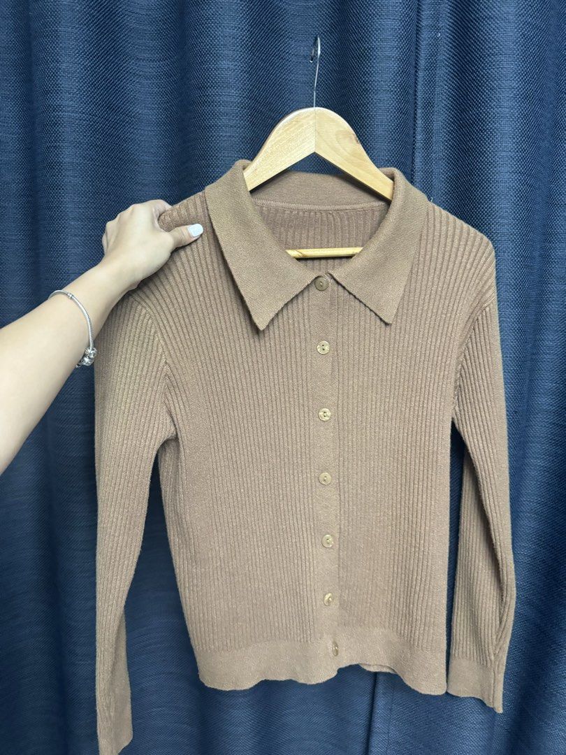 Brown Ribbed Knit Cardigan with Collar (Category: Coats, Jackets and Outerwear) located in Quezon City. Submitted by euniceescalada9 (Listing ID 1467198388, Image 1). Description: - Color: Brown neutral tone - Style: Fitted silhouette with classic collar and front buttons - Material: Soft ribbed knit texture - Features: Long sleeves, easy to layer or wear on its own - Condition: Good staple piece for cooler weather.