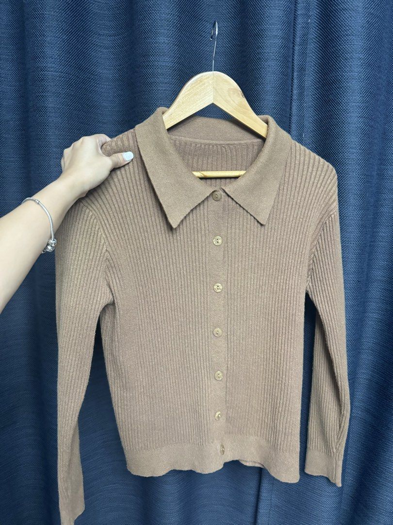 Brown Ribbed Knit Cardigan with Collar (Category: Coats, Jackets and Outerwear) located in Quezon City. Submitted by euniceescalada9 (Listing ID 1467198388, Image 2). Description: - Color: Brown neutral tone - Style: Fitted silhouette with classic collar and front buttons - Material: Soft ribbed knit texture - Features: Long sleeves, easy to layer or wear on its own - Condition: Good staple piece for cooler weather.