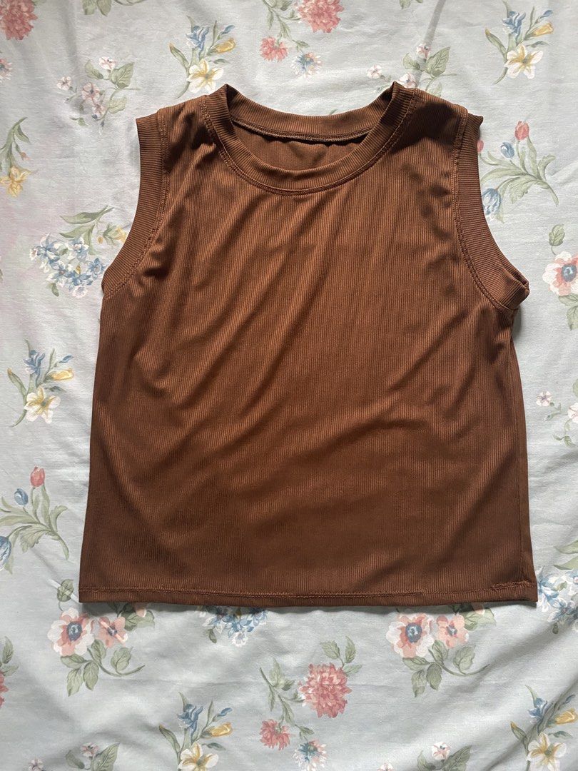 Brown Vest (Category: Others Tops) located in Manila. Submitted by danie_sells (Listing ID 1467240385, Image 1). Description: - Color: Brown - Material: Soft stretch fabric - Neckline: Classic crew neck - Style: Versatile basic, great for layering or pairing with jeans and skirts ——— PAYO. Pay As You Order. 💵 MOP: Maribank 🚚 MOD: Lalamove or JnT 📍 Loc: Bacoor, Cavite 📍Alt Loc: Sampaloc, Manila.