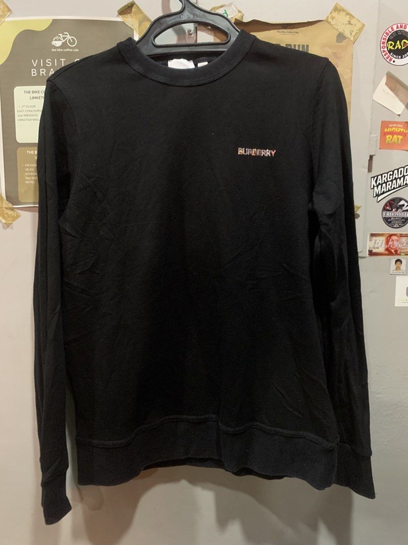 Burberry Black Crystal Logo Sweatshirt (Category: Luxury Apparel) located in Cagayan de Oro. Submitted by agboysalis60090 (Listing ID 1467338796, Image 1). Description: Black crewneck sweatshirt from Burberry London England. Made in Portugal. 100 percent cotton body with elastane blend ribbing. Size small tag attached. Small embroidered lettering on the chest. Large crystal rhinestone monogram logo graphic on the back. Long sleeves with ribbed cu