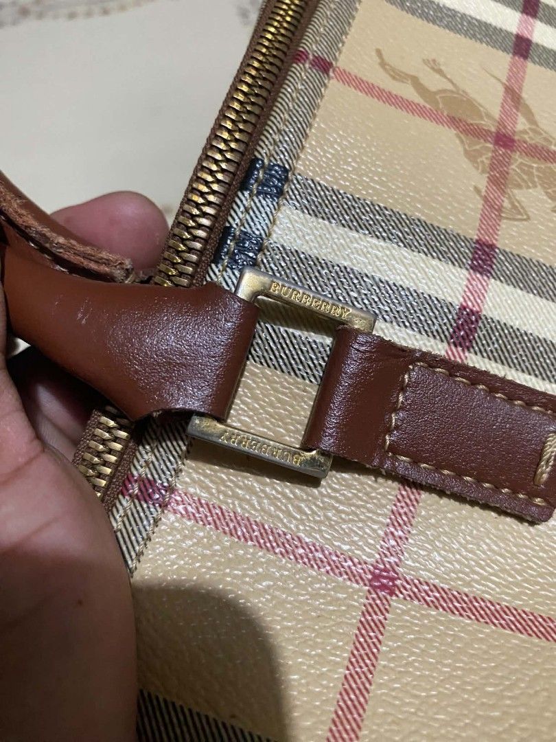 Burberry Vintage Nova Check Barrel Handbag (Category: Luxury Bags & Wallets) located in Cebu City. Submitted by tlisurplus (Listing ID 1467274363, Image 2). Description: - Authentic Burberry barrel handbag in iconic beige Nova check canvas - Features durable brown leather top handles and trim - Secure top zip closure with branded metal pull - Clean dark fabric interior with convenient inner slip pocket and leather tag - Compact size, ideal for da