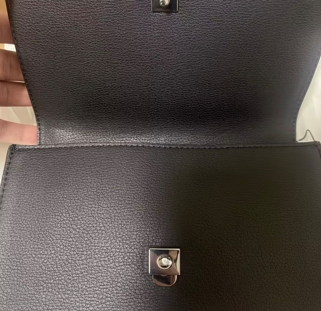 Calvin Klein Jeans Black Shoulder Bag (Category: Shoulder Bags) located in Pasay City. Submitted by kgemsluxuryboutique (Listing ID 1467339942, Image 3). Description: - Brand: Calvin Klein Jeans - Style: Crossbody bag - Color: Classic Black - Material/Texture: Structured pebbled finish - Hardware: Silver-tone with prominent front CK logo - Strap: Stylish metal chain links - Condition: Brand new with tags attached, includes original dust bag PLEAS