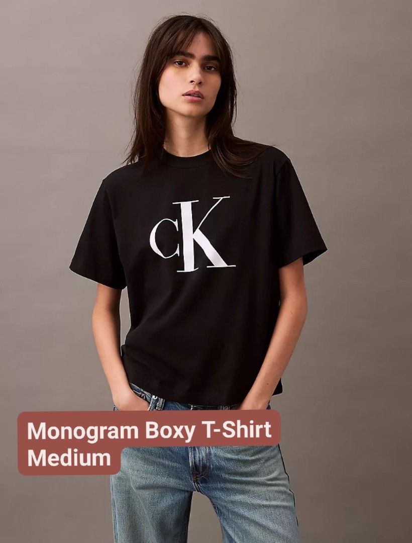 Calvin Klein Monogram Boxy T-Shirt Medium (Category: Shirts) located in Manila. Submitted by kpayum (Listing ID 1467200698, Image 1). Description: - Brand: Calvin Klein - 💯 Authentic from 🇱🇷 - Color: Black - Size: Medium - Fit: Relaxed boxy fit with crew neckline and short sleeves - Design: Large white monogram logo on the front - Material: Soft, comfortable 100% cotton - Style Tip: Pairs easily with blue jeans or casual trousers.