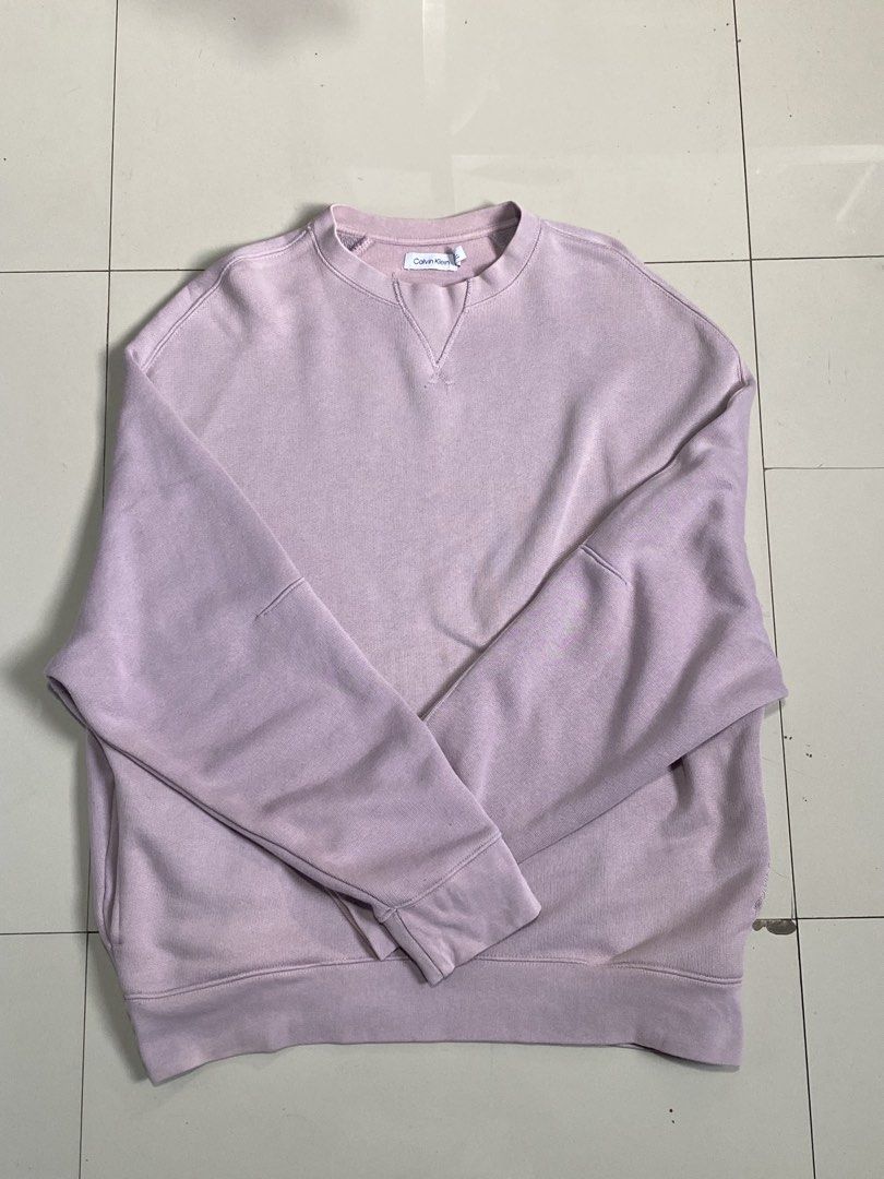 Calvin Klein Purple Sweatshirt Size M (Category: Coats, Jackets and Outerwear) located in Baguio. Submitted by yunothewizardking (Listing ID 1467362558, Image 1). Description: - Brand: Calvin Klein - Color: Dusty Purple - Size: Medium (Regular fit) - Material: Comfortable cotton and polyester blend with warm fleece lining - Details: Embroidered logo lettering on the sleeve, classic collar inset, and ribbed cuffs and hem - Perfect for casual styli