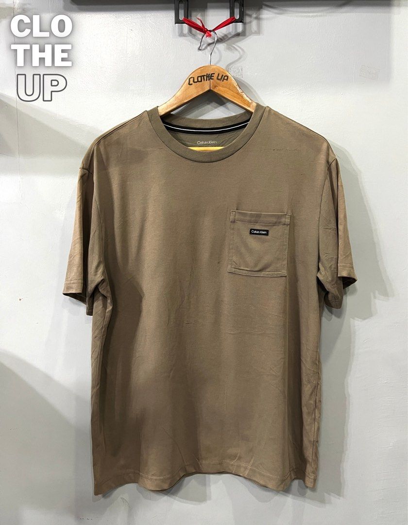 Calvin Klein Shirt (Category: Tshirts & Polo Shirts ) located in Davao. Submitted by clotheupthrifts (Listing ID 1467292511, Image 1). Description: size L dimes 22.5 W 28 L, Good as new, No issues, 10/10 color rate.