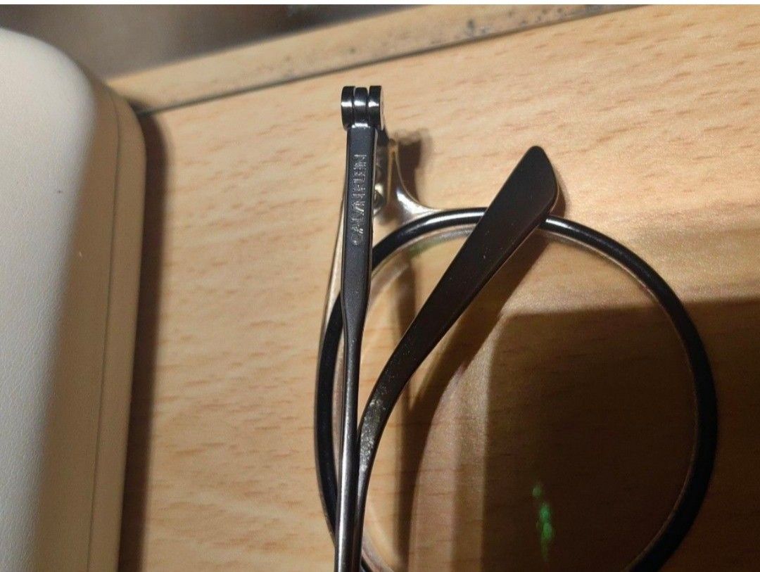 Calvin Klein Titanium CK18705 Eyeglass Frames (Category: Sunglasses & Eyewear) located in Cavite. Submitted by klosetnijuan (Listing ID 1467257485, Image 3). Description: Titanium frames from Calvin Klein, model CK18705. Black and clear front rims with silver temples. Measurements stamped on arm: 49-19-140. Includes original white Calvin Klein Jeans hard case and a free Vision Express voucher card - lense grade up to 300..