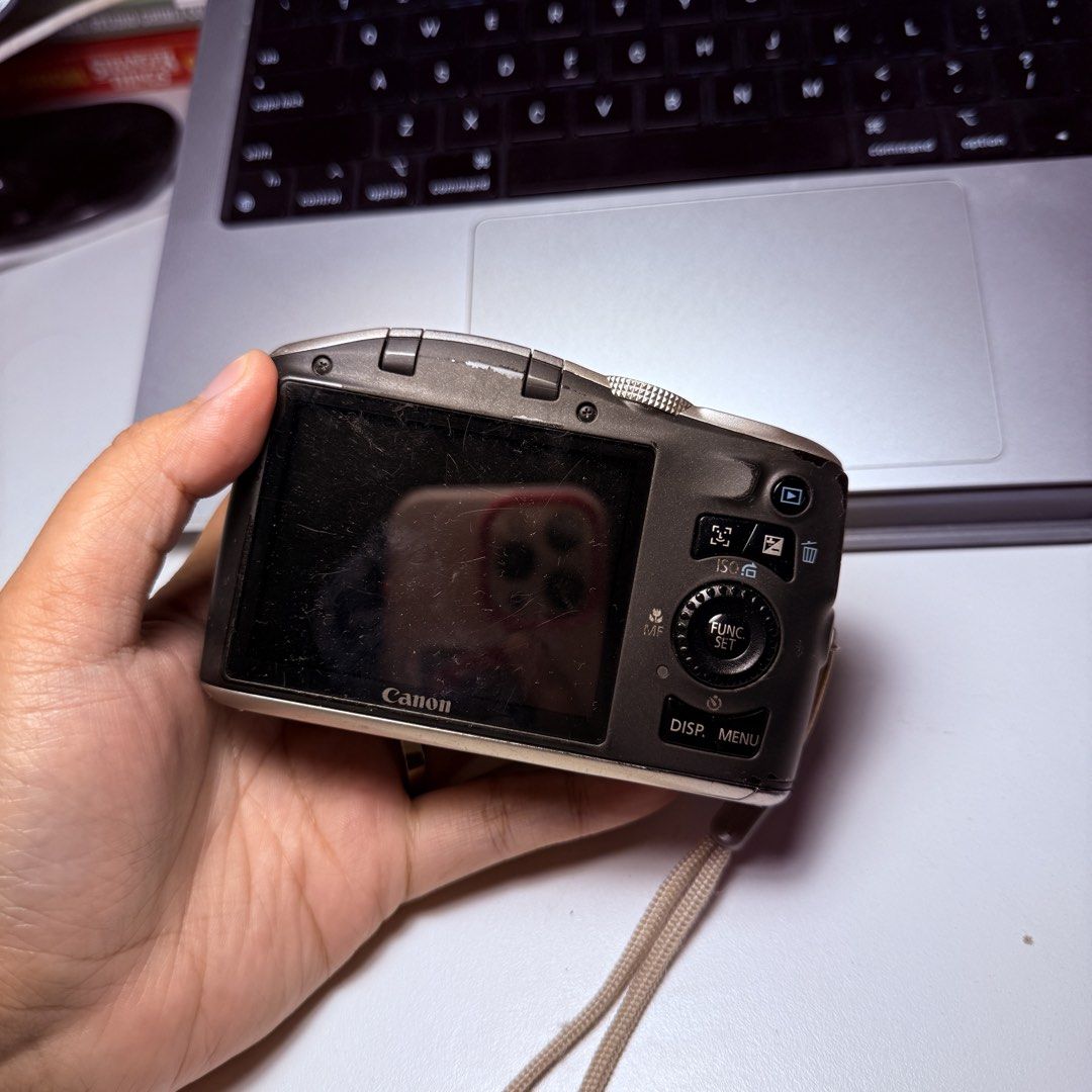 Canon PowerShot SX120 IS Digital Camera (Category: Cameras) located in Quezon City. Submitted by daniellenavarrete0720 (Listing ID 1467305469, Image 3). Description: - Model: Canon PowerShot SX120 IS - Color: Elegant Gold - Condition: Tested and 100% working - Lens: 12x optical zoom for versatile shooting - Modes: Full manual settings, auto, and various scene modes via top dial - Features: Built-in flash, clear LCD screen, and rear control dial -