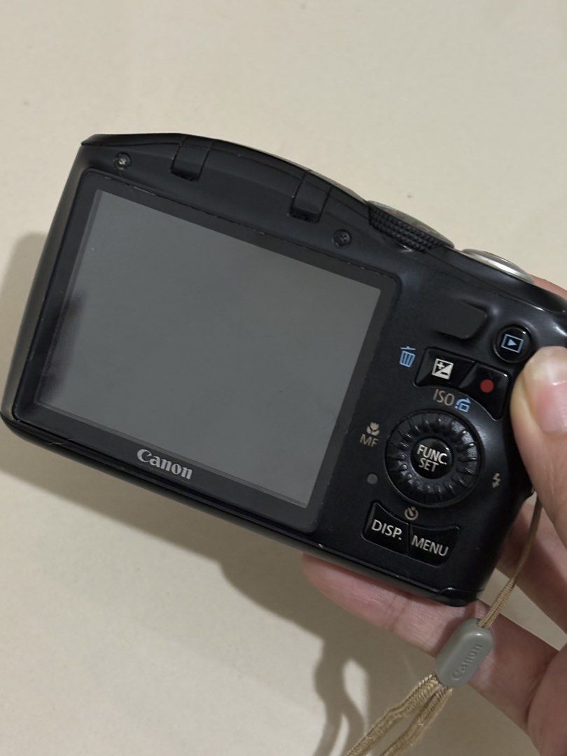 Canon PowerShot SX150 IS Digital Camera (Category: Cameras) located in Manila. Submitted by nicoleannejns (Listing ID 1467356045, Image 3). Description: - Model: Canon PowerShot SX150 IS (Black) - Resolution: 14.1 Megapixels with 12x Optical Zoom - Condition: Tested and works perfectly - Power: Uses standard AA batteries - Inclusions: Eveready battery charger, 2 rechargeable batteries, camera pouch, and attached wrist strap - Perfect for: Everyda
