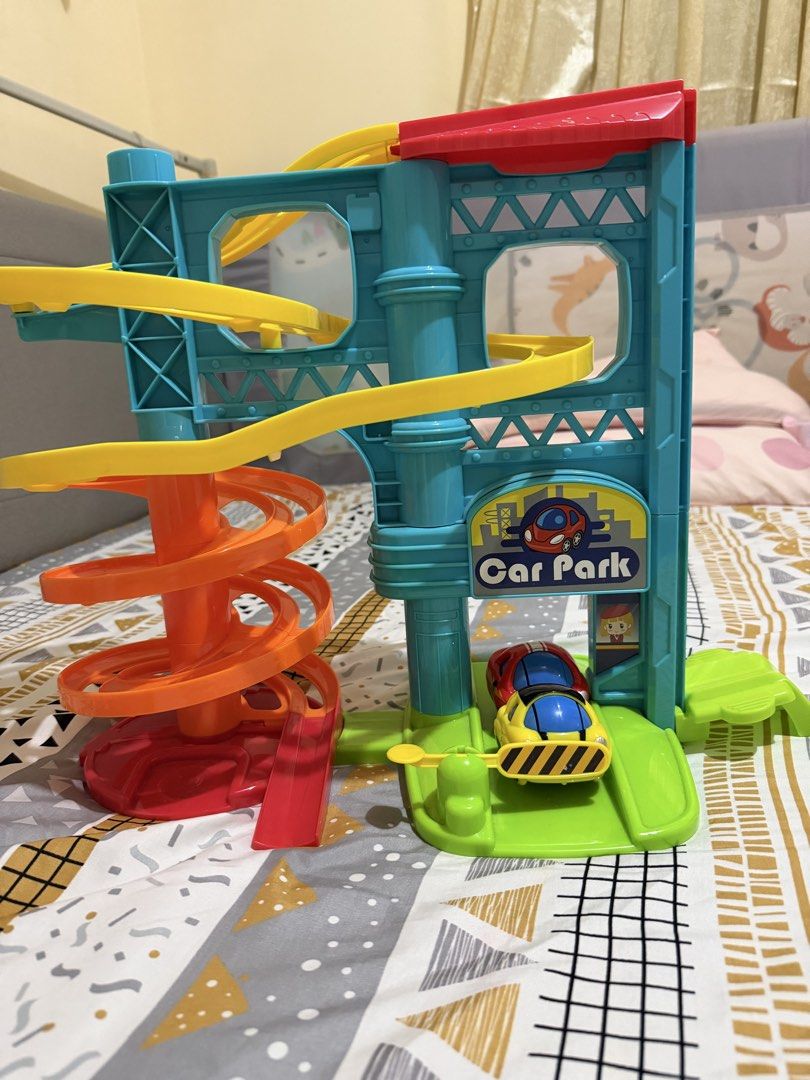 Car Park Toy (Category: Infant Playtime) located in Manila. Submitted by declutterwithkaren22 (Listing ID 1467310764, Image 2). Description: Bought from Rustan’s for Php500 Some signs of usage, but complete parts Great for babies/Toddlers Rfs: upgrading to a track for bigger kids.