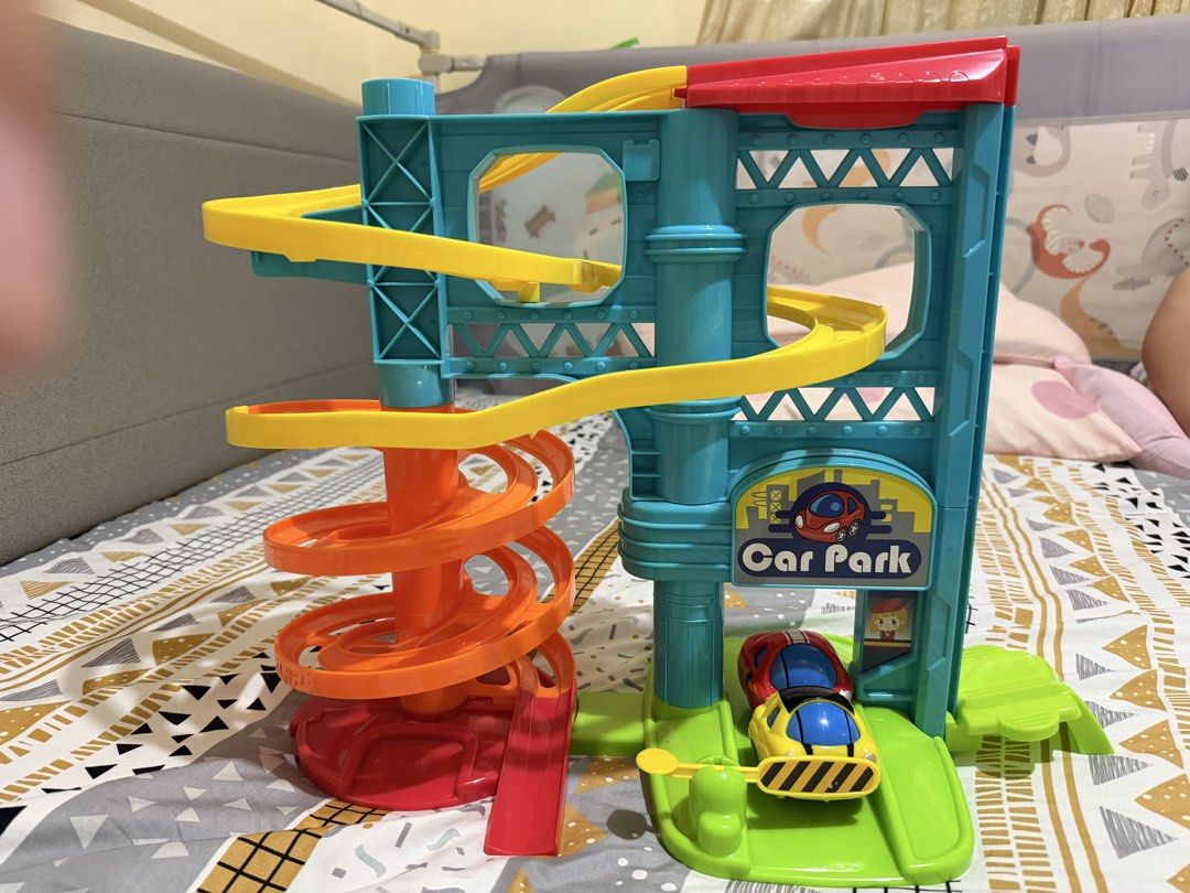Car Park Toy (Category: Infant Playtime) located in Manila. Submitted by declutterwithkaren22 (Listing ID 1467310764, Image 3). Description: Bought from Rustan’s for Php500 Some signs of usage, but complete parts Great for babies/Toddlers Rfs: upgrading to a track for bigger kids.