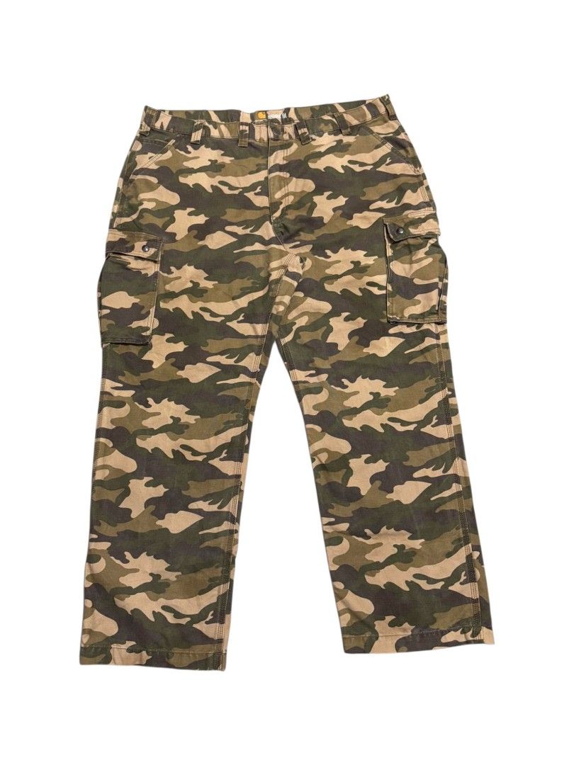 Carhartt Camouflage Cargo Pants (Category: Jeans) located in Bauan. Submitted by onetwothrift2 (Listing ID 1467221319, Image 1). Description: Carhartt Camou Cargo Pants Waist: 44-45 Length: 44.5 Leg opening: 10 Color rate: 9.5/10 Excellent condition No issue.