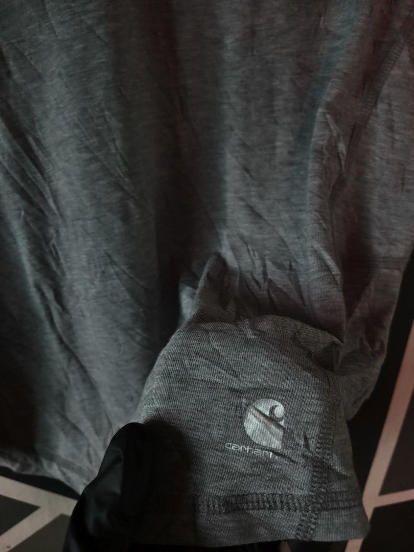 Carhartt Force Grey V-Neck Tee Size L 12-14 (Category: Activewear) located in Manila. Submitted by choycleverdeer.f04b80 (Listing ID 1467320689, Image 3). Description: - Brand: Carhartt Force - Color: Grey - Style: V-neck with short sleeves - Size: M - Details: Small logo near hem, Carhartt Force print on back yoke - Material: 81% polyester, 14% cotton, 5% spandex - Origin: Made in Guatemala.