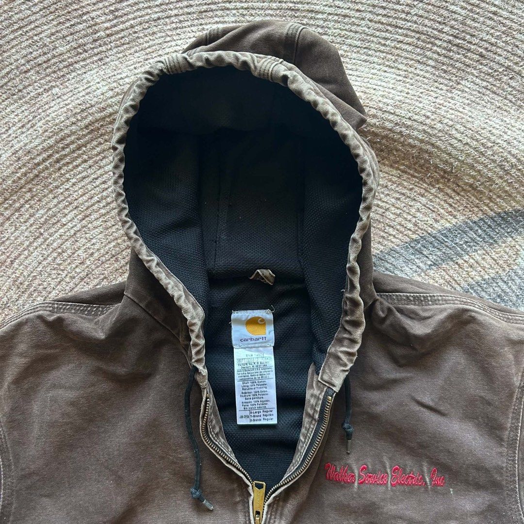 Carhartt J25 DNB Duck Active Jacket Extra Large Regular (Category: Coats, Jackets and Outerwear) located in Manila. Submitted by marx_g (Listing ID 1467357875, Image 3). Description: - Brand: Carhartt - Style: Duck active jacket with mesh lining - Color: Brown with a great natural fade - Features: Attached hood with drawstrings, front zipper closure, ribbed cuffs and hem - Detail: Embroidered 'Walker Service Electric, Inc.' text on the chest - Co