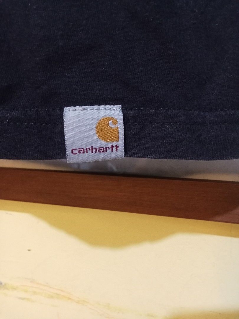 Carhartt WIP Script Escape T-Shirt Black Size M (Category: Tshirts & Polo Shirts ) located in Manila. Submitted by okellorrai95403 (Listing ID 1467231561, Image 2). Description: - Brand: Carhartt WIP - Color: Black - Size: Medium (Measures 20" x 28") - Design: Large front logo, 'Exquisite, Escape' text, and wheel graphic - Material: 100% cotton - Details: Includes neck tag and woven hem label - Condition: Clean, excellent overall condition.