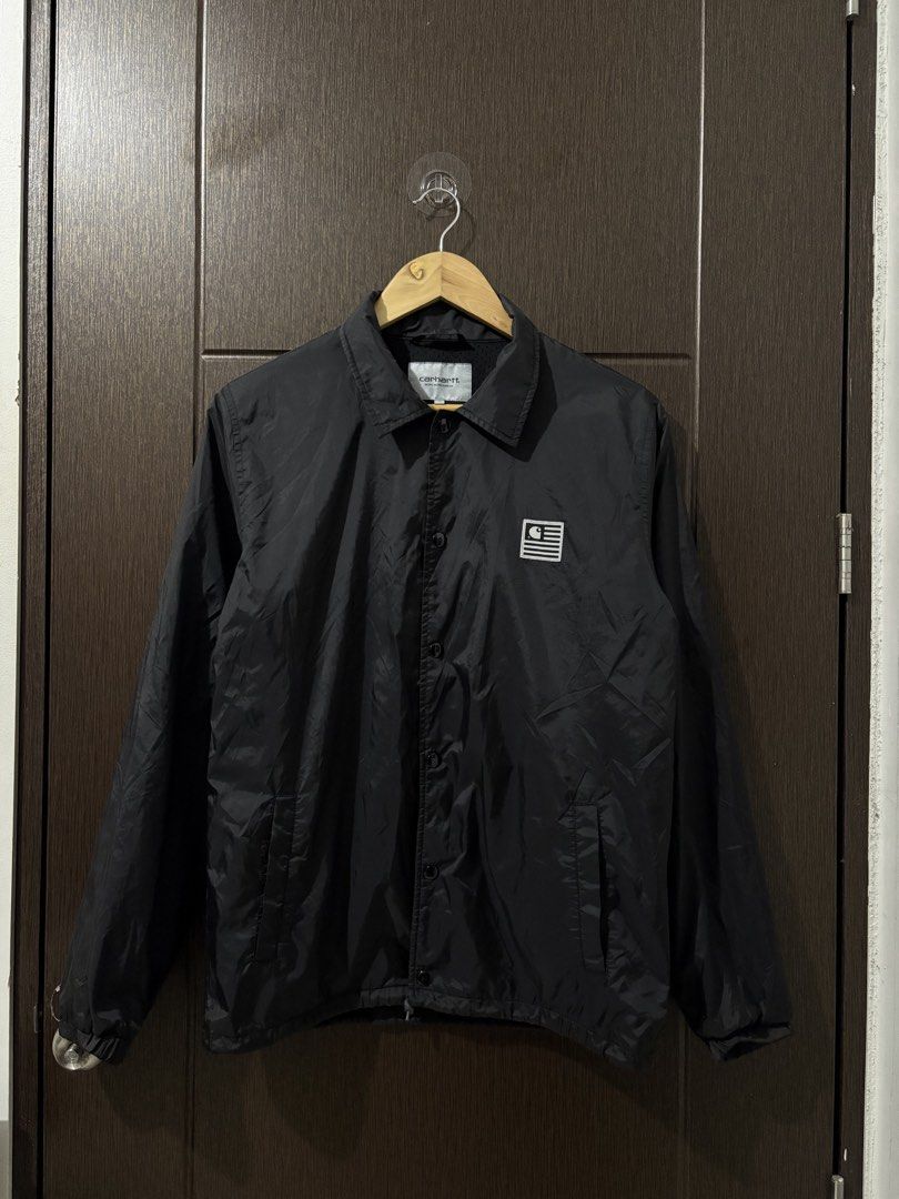 CARHARTT WIP STATE FLAG COACH JACKET (Category: Coats, Jackets and Outerwear) located in Naga. Submitted by sislovesme (Listing ID 1467299599, Image 1). Description: •9.5/10 CONDITION •NO FLAWS •SIZE SMALL ON TAG •WIDTH 21 INCHES •LENGHT 27 INCHES.