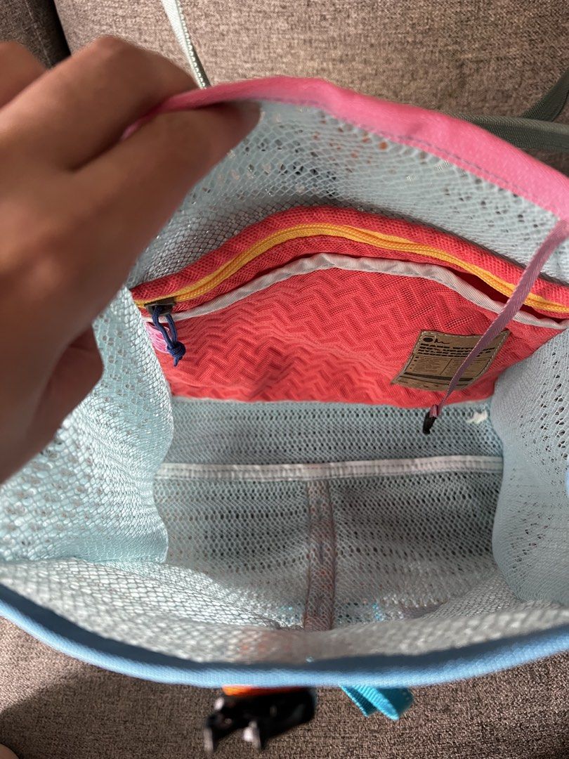 Carry Om (Category: Tote Bags) located in Las Pinas. Submitted by elai18 (Listing ID 1467234475, Image 2). Description: - Authentic Barbie branding tags - Light blue mesh tote bag with a bright, colorful mix of materials - Orange center strap featuring playful blue bow accents and a buckle closure - Pink inner compartment equipped with a handy zipper pocket - Comfortable double shoulder straps in pale green Medium size Rfs: Too small for me Retai