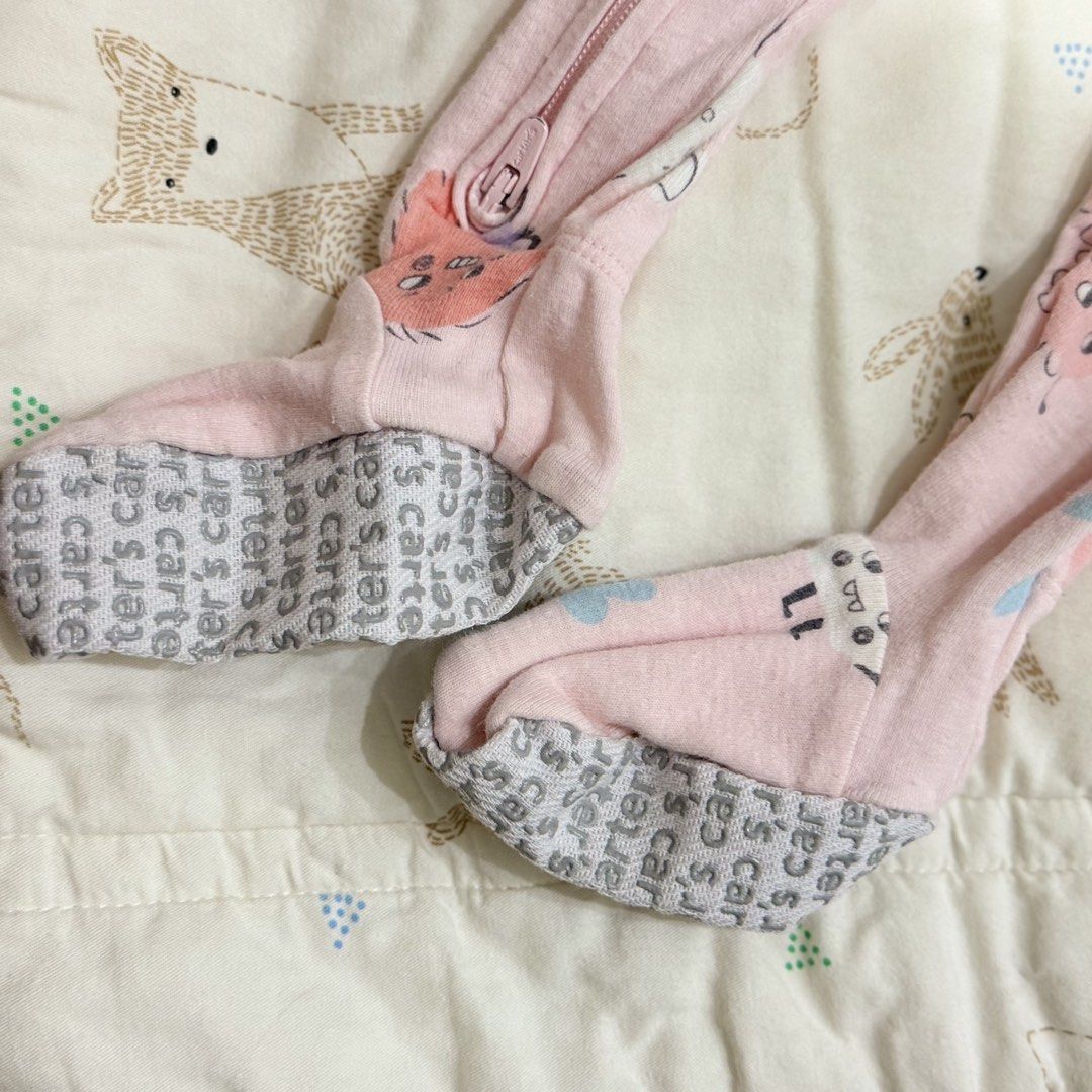Carter's Pink Monster Print Footed Sleeper 12M (Category: Babies & Kids Fashion) located in Paranaque City. Submitted by yuffie__ (Listing ID 1467188113, Image 2). Description: - Brand: Carter's - Size: 12 Months - Design: Pink cotton sleeper with quirky blue, orange, and pink little monster prints - Features: Full zip front with neckline snap tab for easy diaper changes - Safety: Built-in feet with grey anti-slip grip soles - Condition: Clean fa
