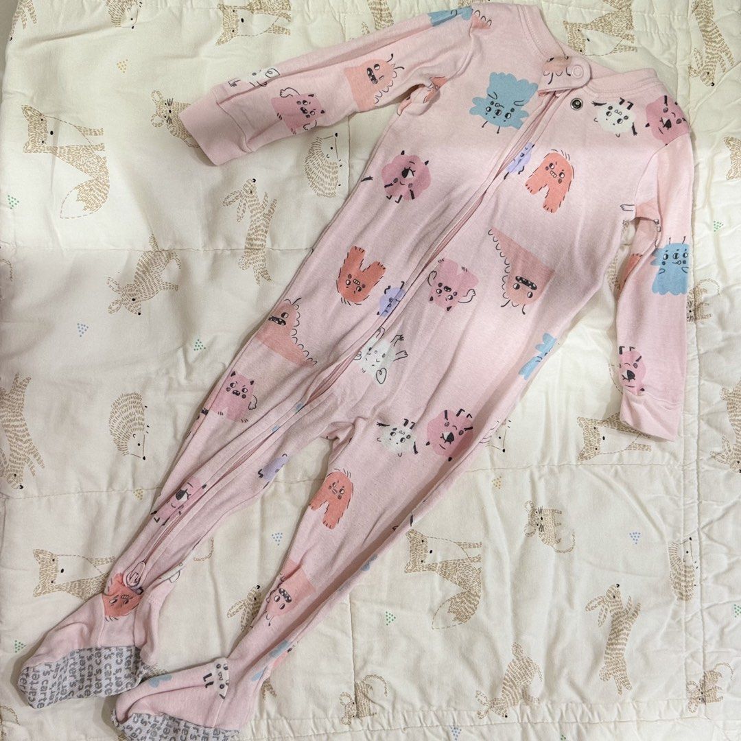 Carter's Pink Monster Print Footed Sleeper 12M (Category: Babies & Kids Fashion) located in Paranaque City. Submitted by yuffie__ (Listing ID 1467188113, Image 1). Description: - Brand: Carter's - Size: 12 Months - Design: Pink cotton sleeper with quirky blue, orange, and pink little monster prints - Features: Full zip front with neckline snap tab for easy diaper changes - Safety: Built-in feet with grey anti-slip grip soles - Condition: Clean fa