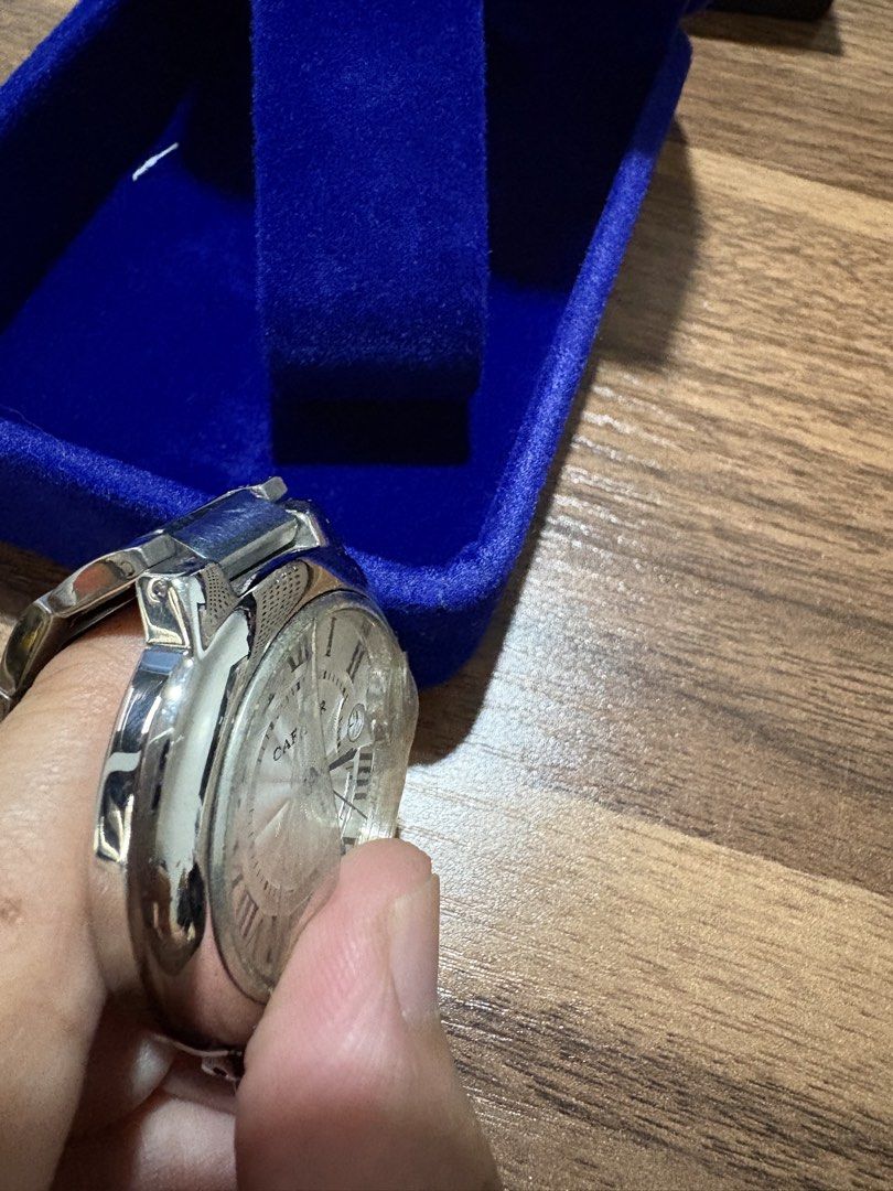 Cartier Ballon Bleu Watch (Category: Luxury Watches) located in Bacoor. Submitted by grandfire.02c841 (Listing ID 1467245313, Image 3). Description: - Brand: Cartier - Model: Ballon Bleu Automatic - Material: Stainless steel case and metal link bracelet - Dial: Silver guilloche with Roman numerals, blued steel hands, and date window at 3 o'clock - Condition: Good working condition, keeps time well, normal wear scratches from daily use - Inclusion