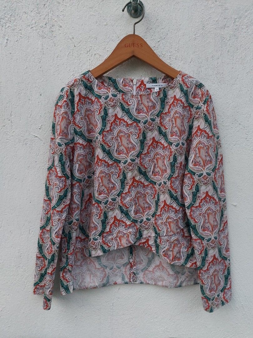 Carven patterned long sleeve blouse size 36 (Category: Longsleeves) located in Lapu Lapu. Submitted by agnesapm_29813 (Listing ID 1467294644, Image 2). Description: - Brand: Carven - Size: 36 (Small) - Pattern: Multicolor paisley (orange, green, white) - Details: Long sleeves, round neckline, back zipper closure, asymmetrical hem - Condition: Excellent pre-loved condition - Measurements: width-18 inches, height-19 inches .
