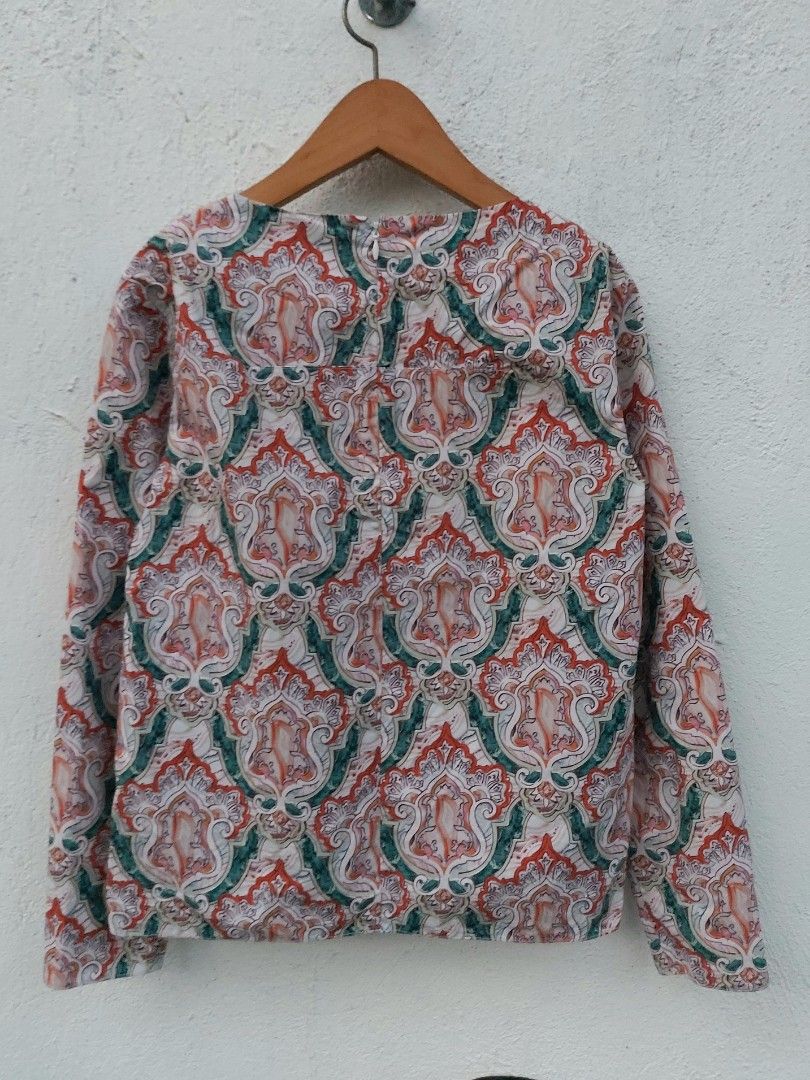 Carven patterned long sleeve blouse size 36 (Category: Longsleeves) located in Lapu Lapu. Submitted by agnesapm_29813 (Listing ID 1467294644, Image 3). Description: - Brand: Carven - Size: 36 (Small) - Pattern: Multicolor paisley (orange, green, white) - Details: Long sleeves, round neckline, back zipper closure, asymmetrical hem - Condition: Excellent pre-loved condition - Measurements: width-18 inches, height-19 inches .